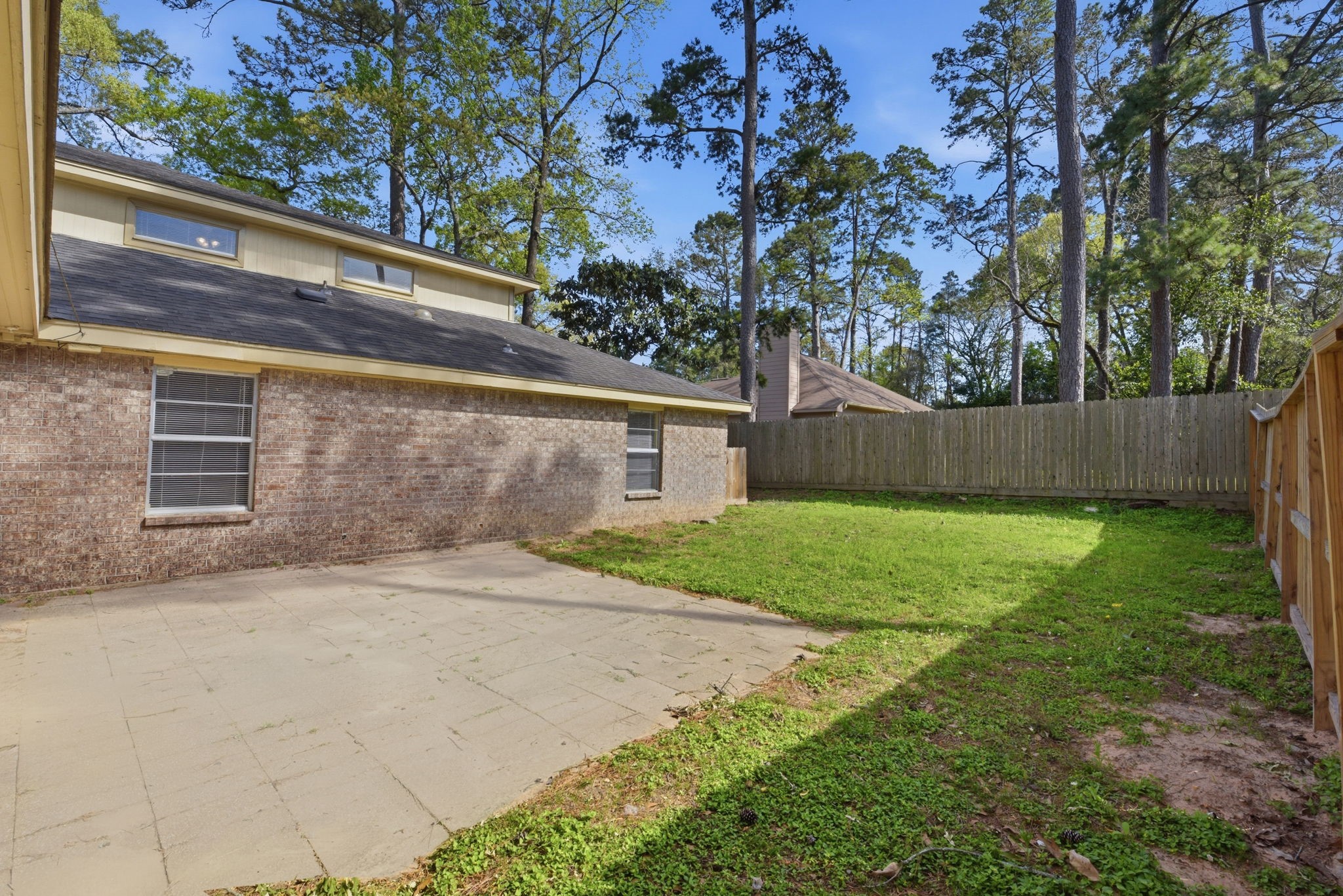 9052 Zapata Way Willis, TX 77378 - Photo 44 of 45 a backyard of a house with lots of green space