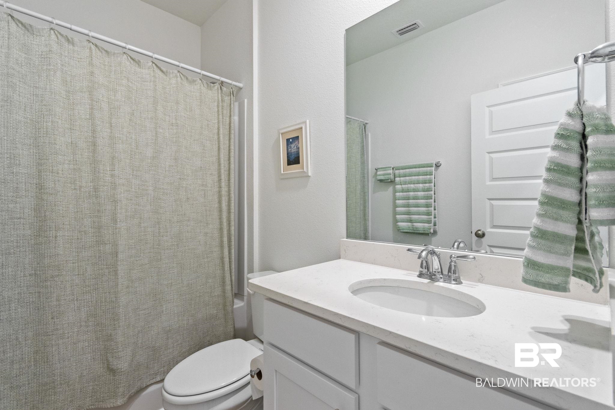 12919 Torrent Road Fairhope, AL 36532 - Photo 39 of 74 Full bath with vanity and shower / bathtub combination with curtain