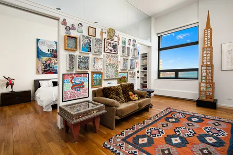 a bathroom with a double vanity sink a mirror and a shower
