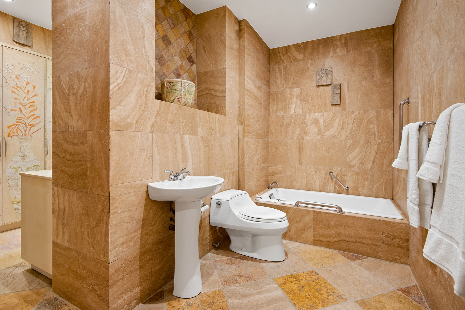 680 North Lake Shore Drive, Unit 1602 Chicago, IL 60611 - Photo 15 of 30 a bathroom with a sink toilet and shower