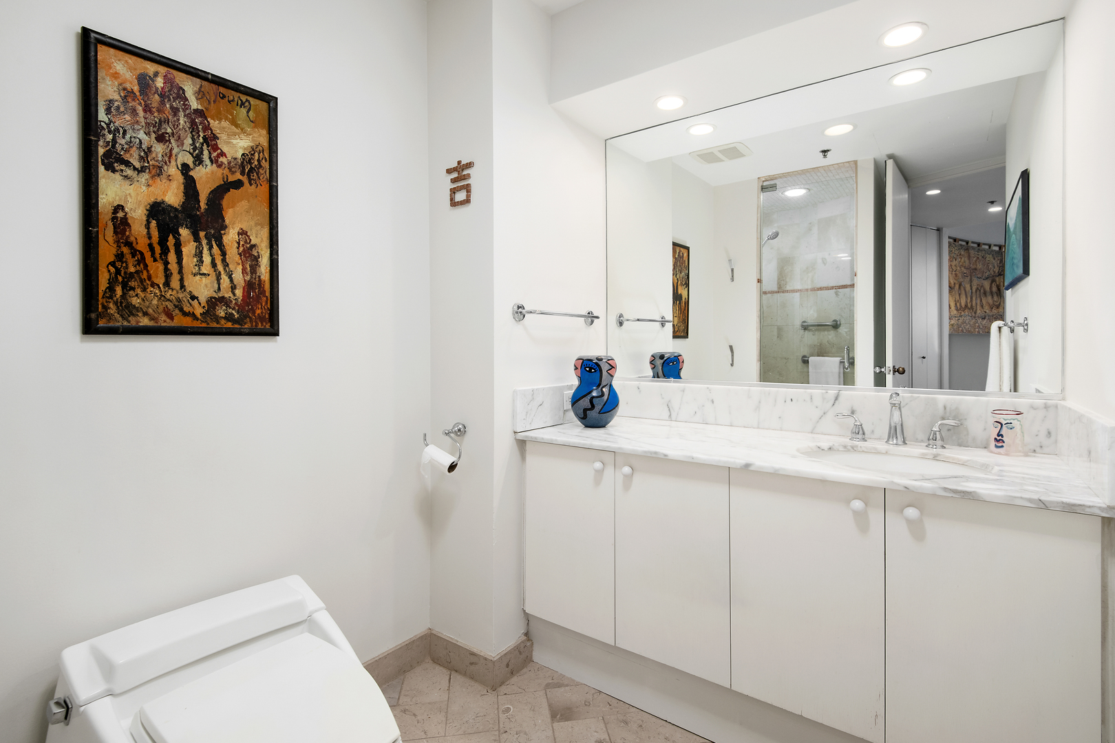 680 North Lake Shore Drive, Unit 1602 Chicago, IL 60611 - Photo 17 of 30 a bathroom with a toilet sink and mirror