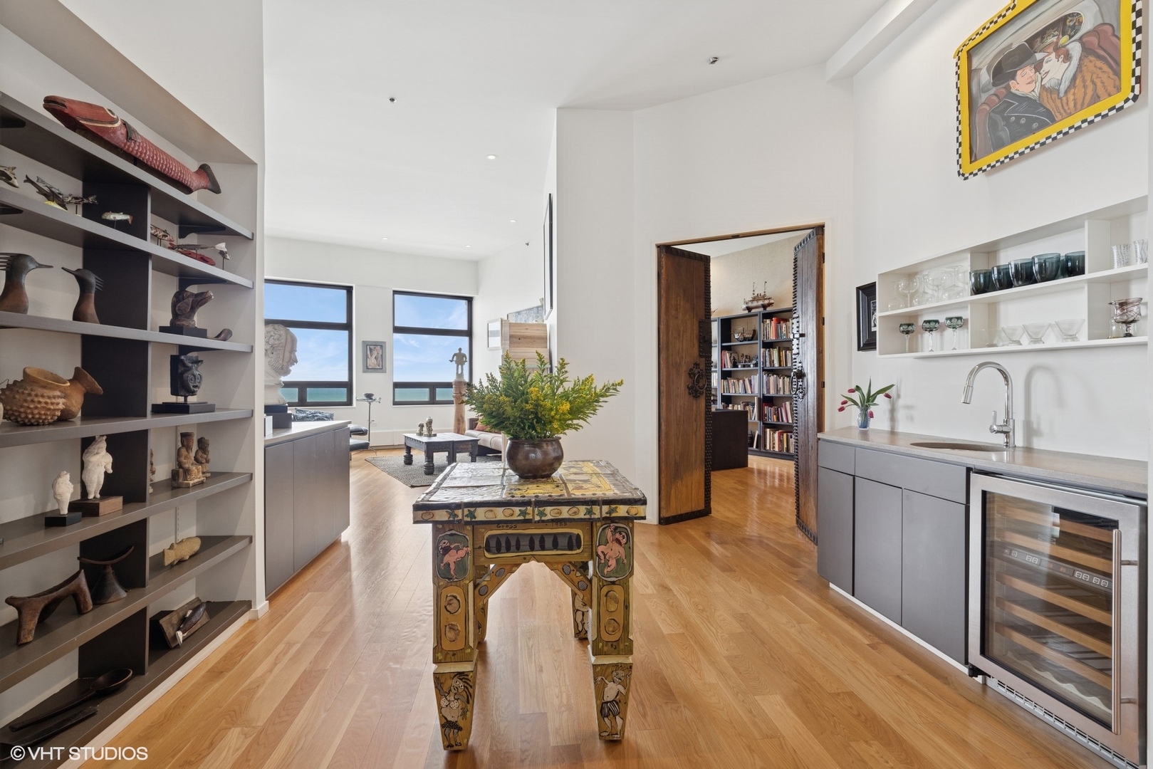 680 North Lake Shore Drive, Unit 1602 Chicago, IL 60611 - Photo 18 of 30 a living room with furniture and a book shelf