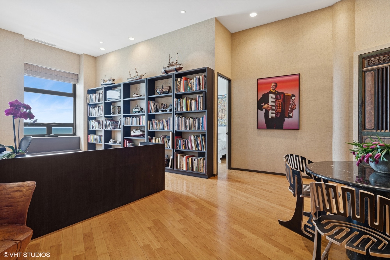 680 North Lake Shore Drive, Unit 1602 Chicago, IL 60611 - Photo 21 of 30 a living room with furniture and a book shelf
