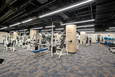 a bathroom with a sink mirror and a bath tub