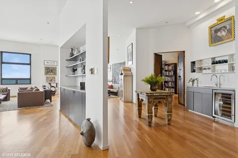a view of a dining room with furniture and window