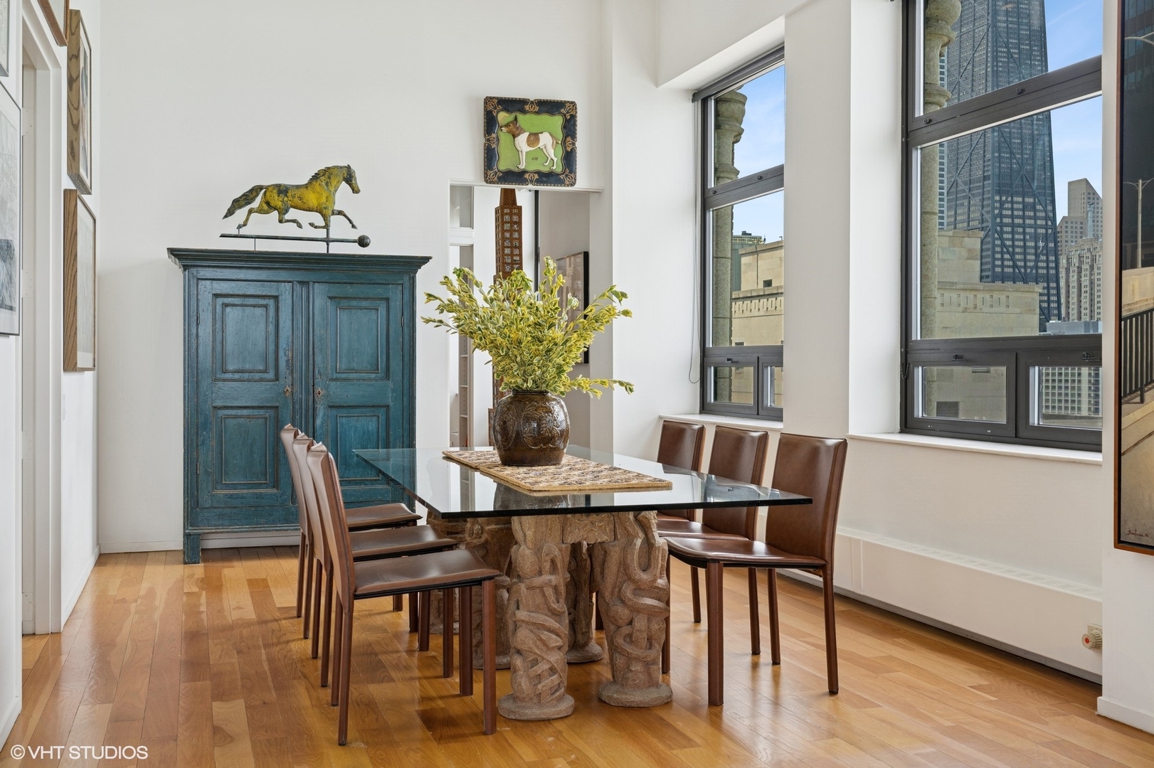 680 North Lake Shore Drive, Unit 1602 Chicago, IL 60611 - Photo 8 of 30 a view of a dining room with furniture window and wooden floor