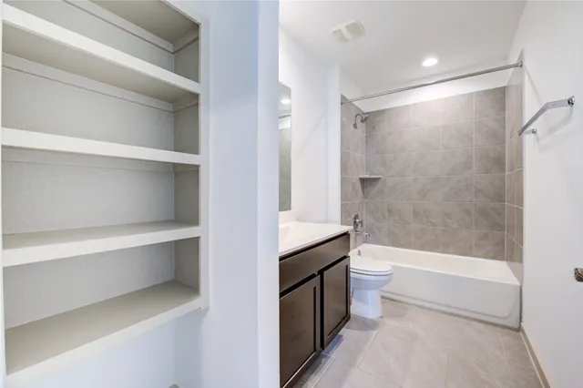 a bathroom with a bathtub shower sink and toilet