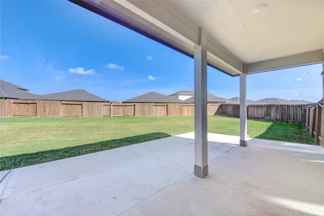 a view of a house with a yard and street