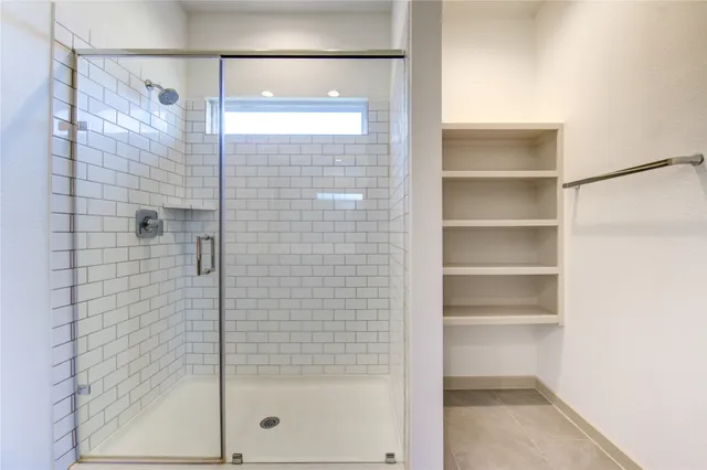 a bathroom with a double vanity sink and mirror