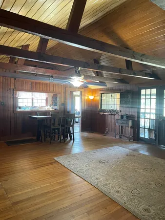 a view of a room with furniture and window