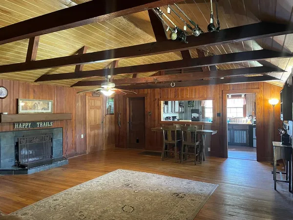 a large kitchen with stainless steel appliances a stove a sink dishwasher and a oven with cabinets