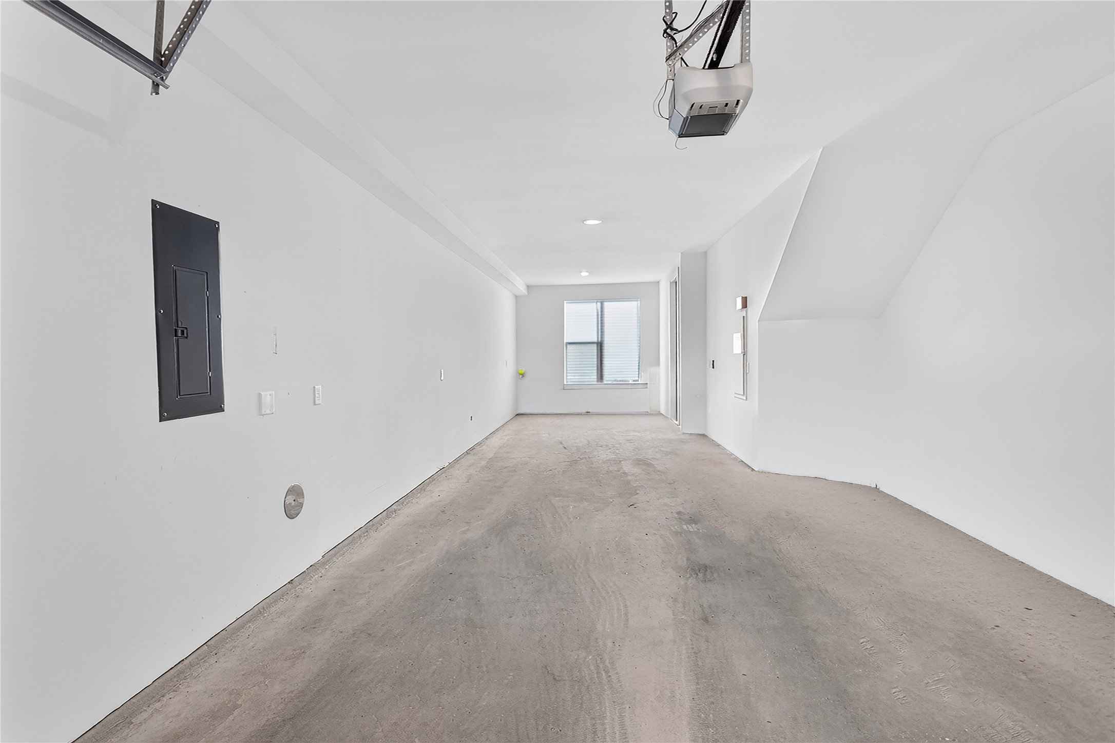 2805 McCurdy Street, Unit 14 Austin, TX 78723 - Photo 15 of 40 A spacious and pristine garage provides ample parking and potential for storage. The front space could easily be enclosed with HVAC for office, workout or flexroom space