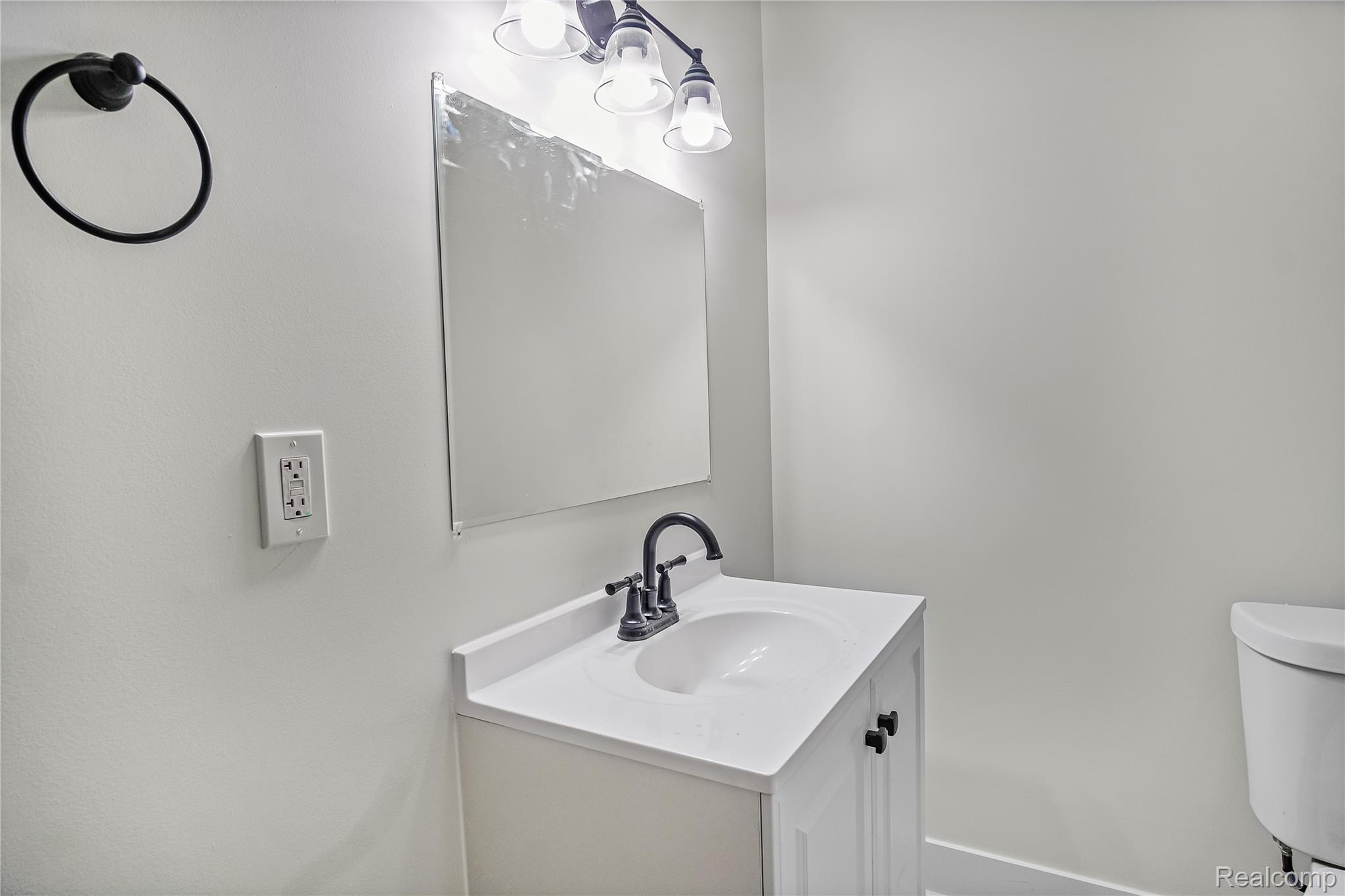 427 Melbourne Street Detroit, MI 48202 - Photo 10 of 29 Half bathroom featuring vanity and toilet