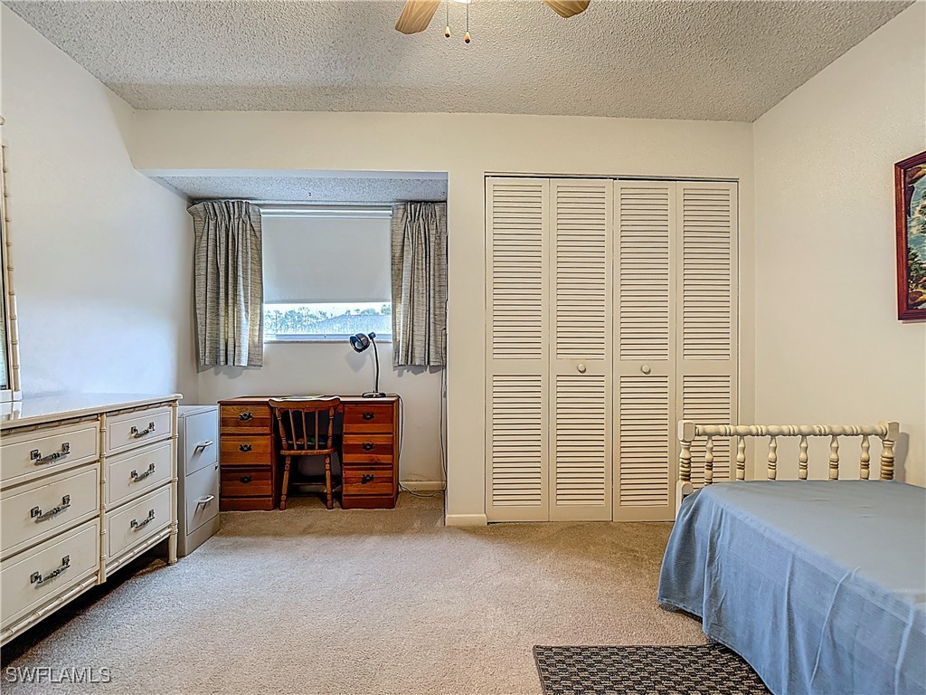 19040 Geranium Road Fort Myers, FL 33967 - Photo 24 of 42 a bedroom with a bed and a dresser