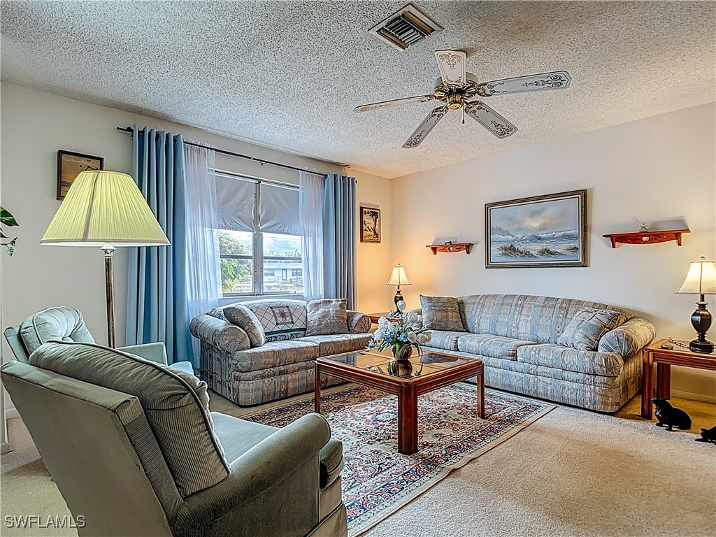 19040 Geranium Road Fort Myers, FL 33967 - Photo 5 of 42 a living room with furniture and a window