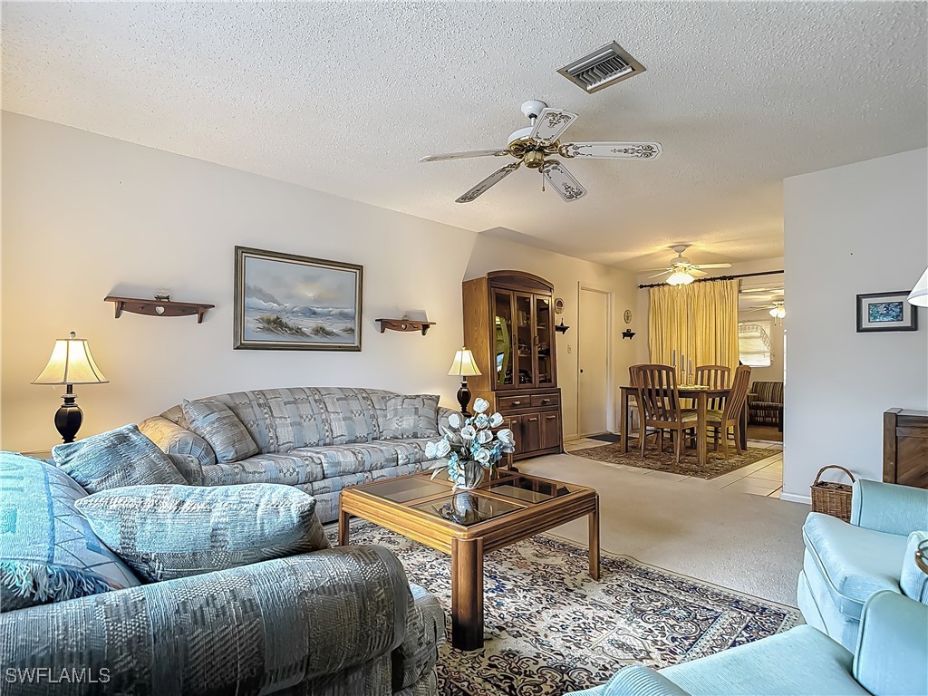 19040 Geranium Road Fort Myers, FL 33967 - Photo 10 of 42 a living room with furniture and wooden floor