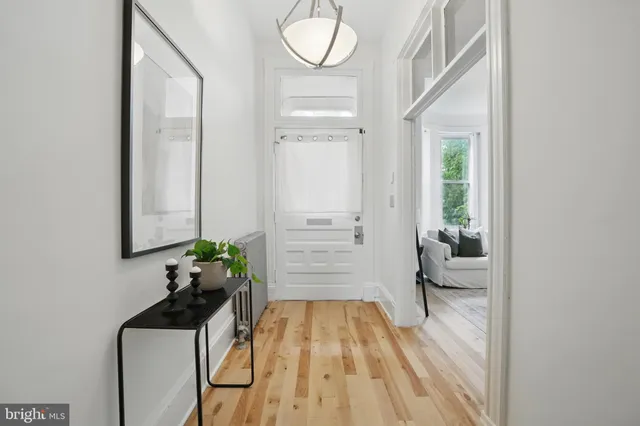 a view of entryway with wooden floor