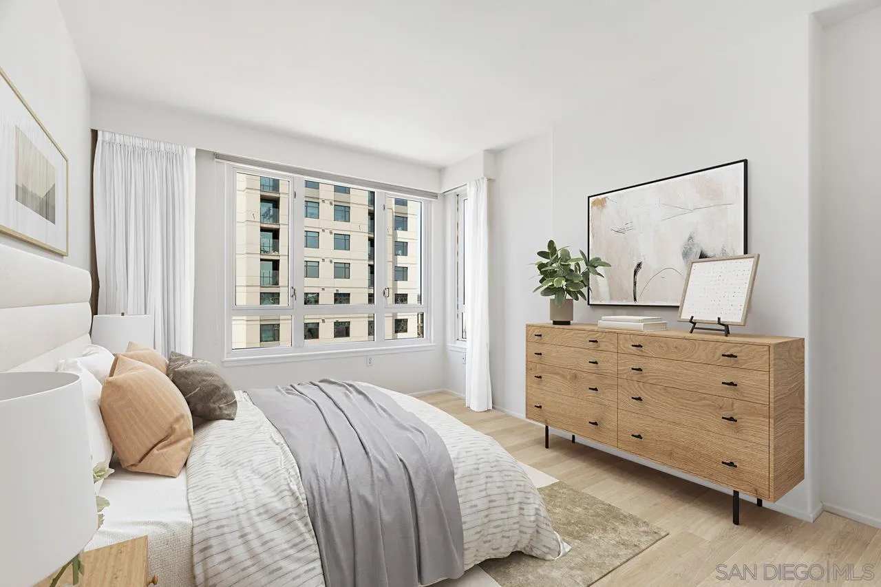 3890 Nobel Drive, Unit 1203 San Diego, CA 92122 - Photo 2 of 22 a bedroom with a bed and a dresser