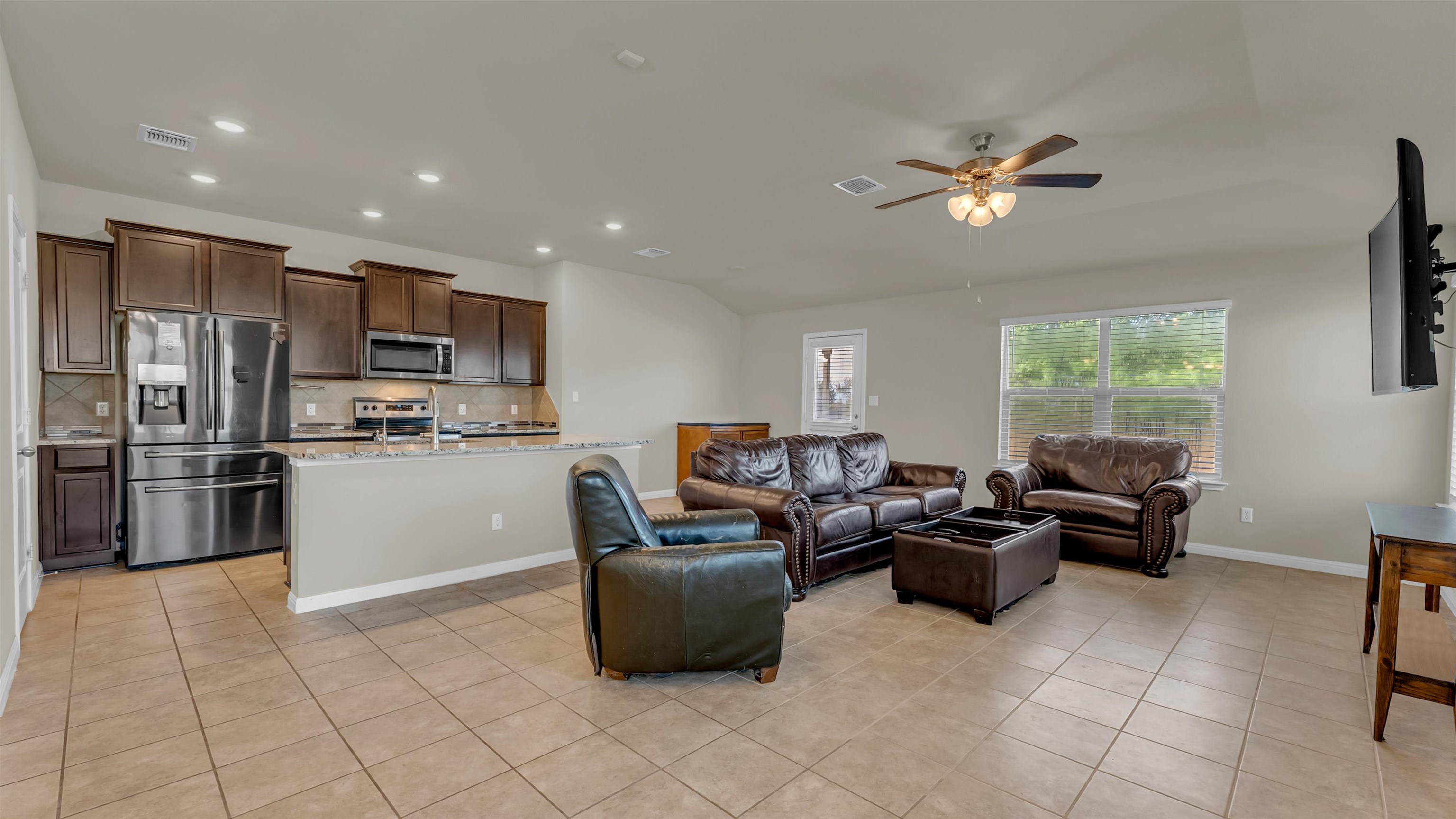 100 Pepper Mill Loop Burnet, TX 78611 - Photo 11 of 27 Living room flowing into open kitchen