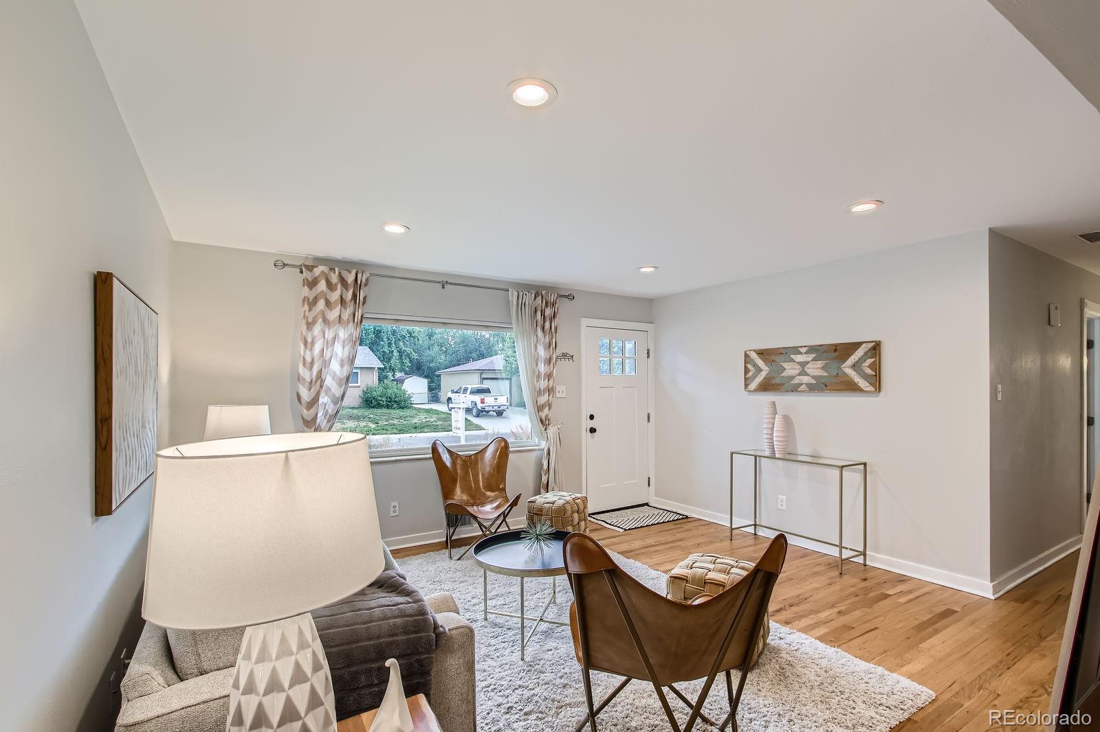 6314 Brooks Drive Arvada, CO 80004 - Photo 11 of 50 a living room with furniture and a window