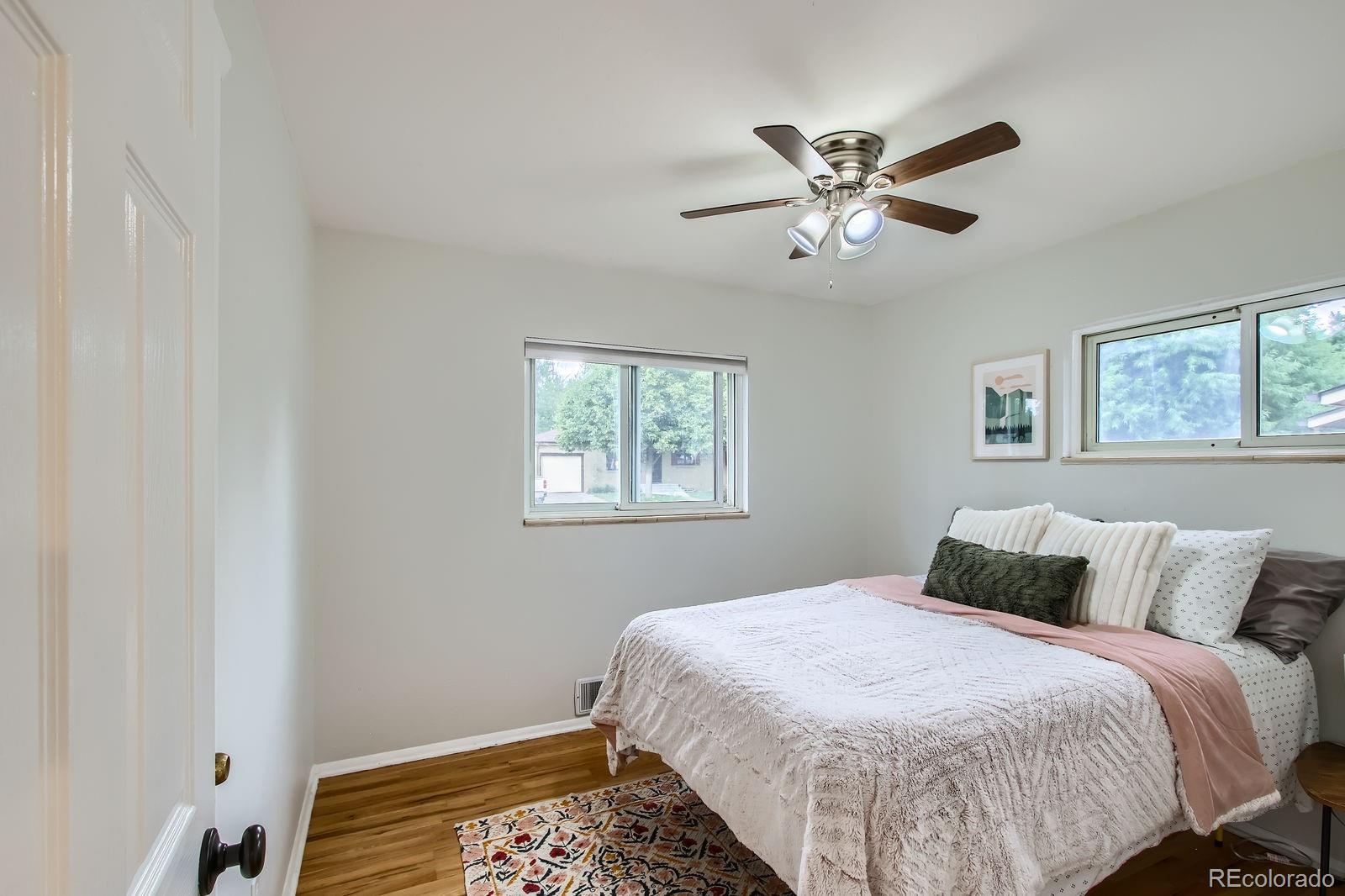 6314 Brooks Drive Arvada, CO 80004 - Photo 18 of 50 a bedroom with a bed and window