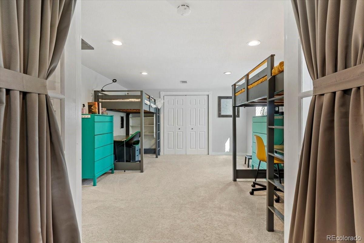 6314 Brooks Drive Arvada, CO 80004 - Photo 23 of 50 a view of a kitchen with fridge and front door