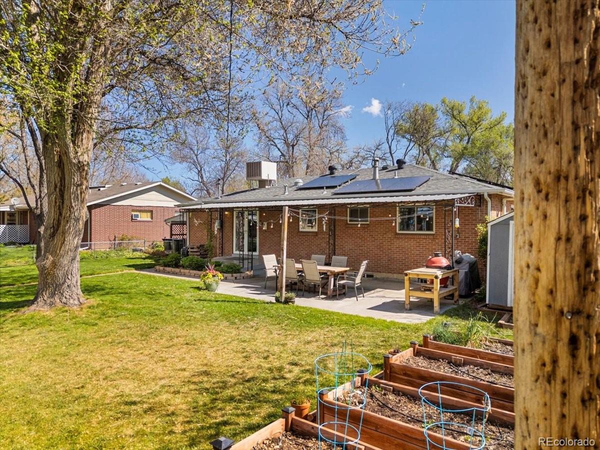 6314 Brooks Drive Arvada, CO 80004 - Photo 30 of 50 a front view of house with yard seating and patio