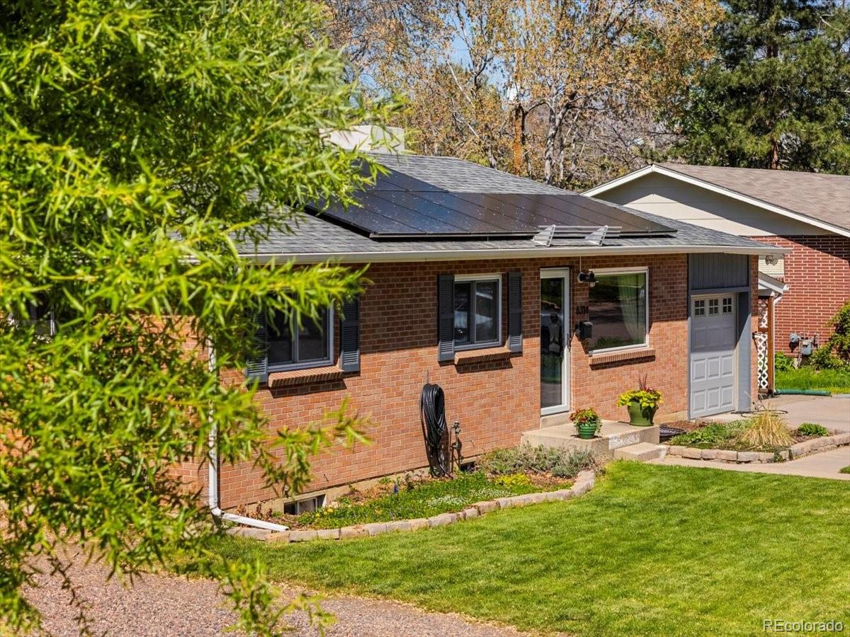 6314 Brooks Drive Arvada, CO 80004 - Photo 34 of 50 a view of a house with backyard and sitting area