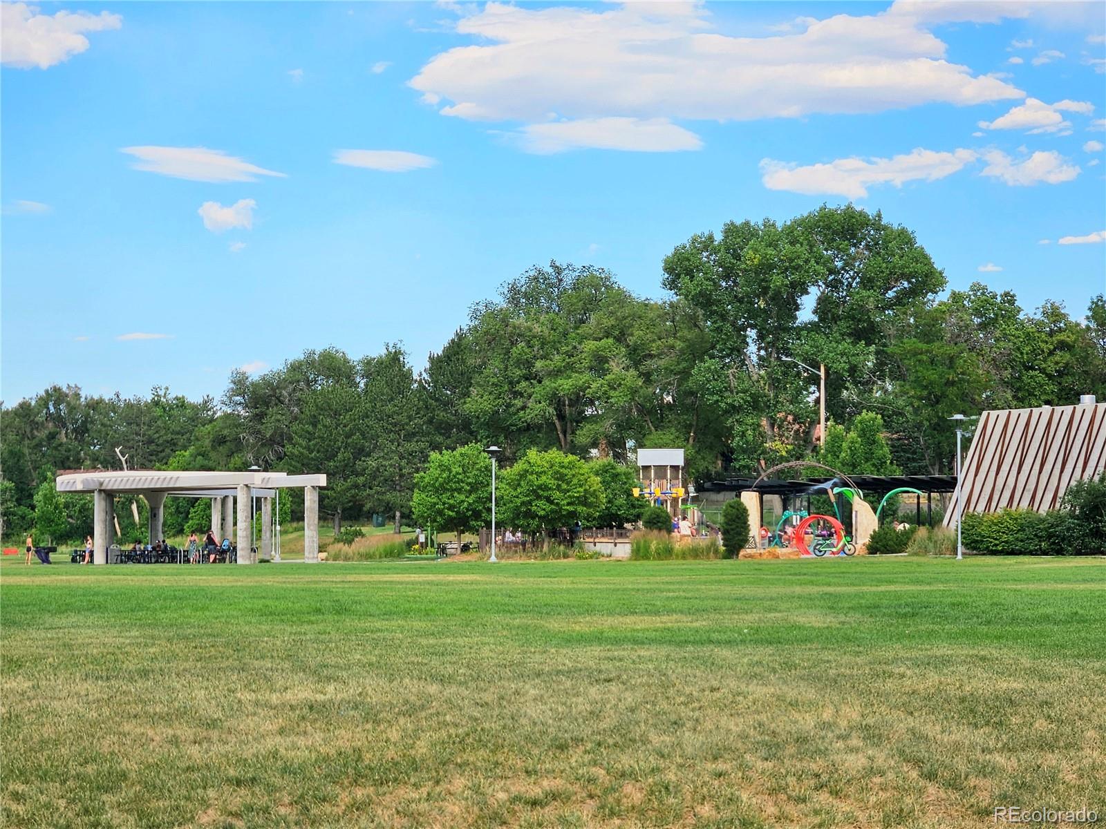 6314 Brooks Drive Arvada, CO 80004 - Photo 45 of 50 a view of green field with house in the background