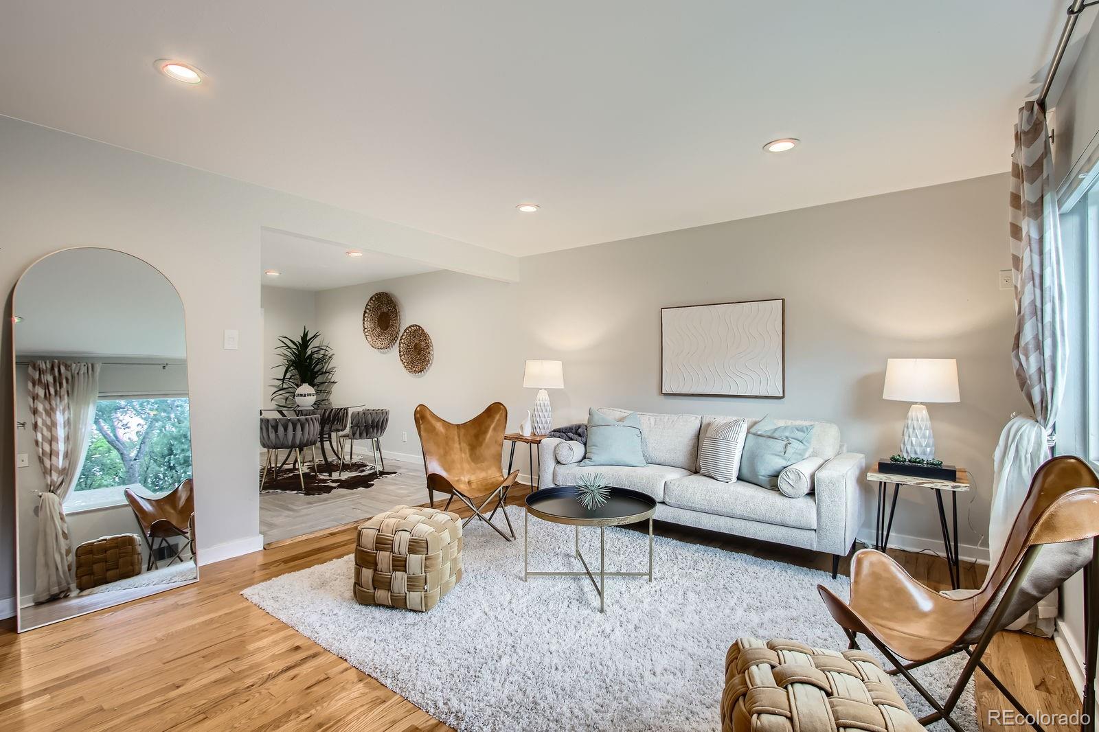 6314 Brooks Drive Arvada, CO 80004 - Photo 5 of 50 a living room with furniture and wooden floor