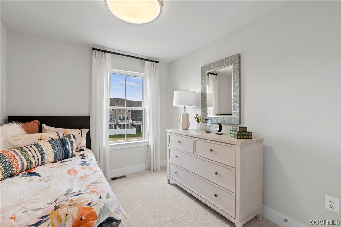 584 Rivanna Hill Road Glen Allen, VA 23060 - Photo 24 of 33 a bedroom with a bed and a dresser