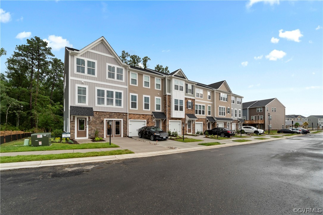 584 Rivanna Hill Road Glen Allen, VA 23060 - Photo 27 of 33 a city street lined with buildings and trees