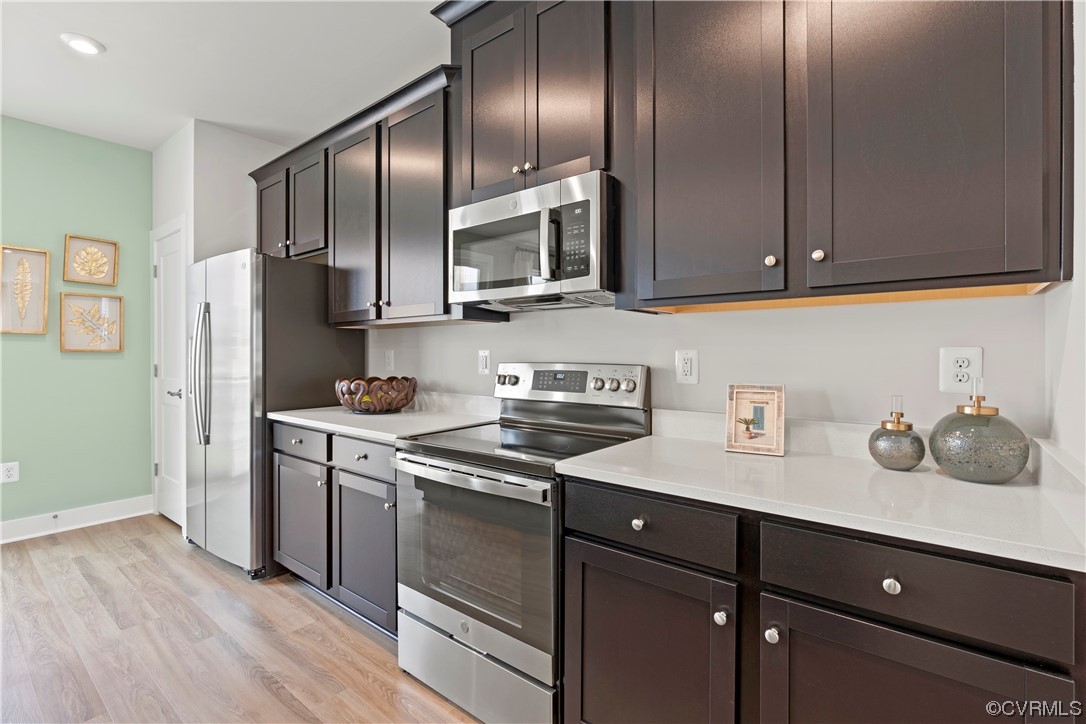584 Rivanna Hill Road Glen Allen, VA 23060 - Photo 6 of 33 a kitchen with stainless steel appliances granite countertop a sink stove and refrigerator