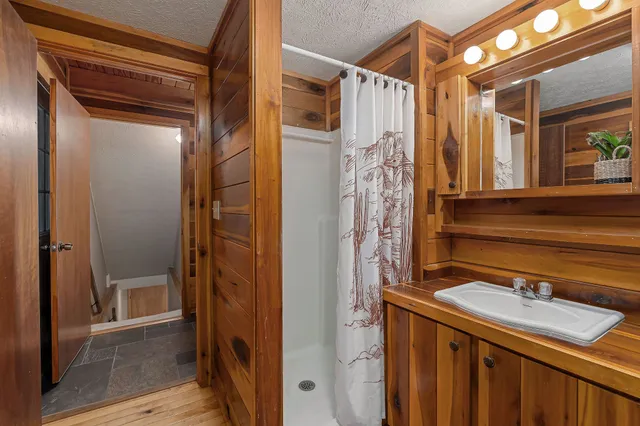 a bathroom with a sink and mirror