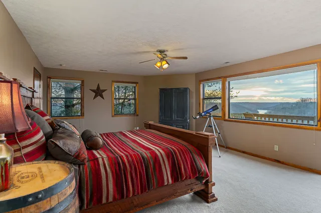 a bed room with a bed and a tv