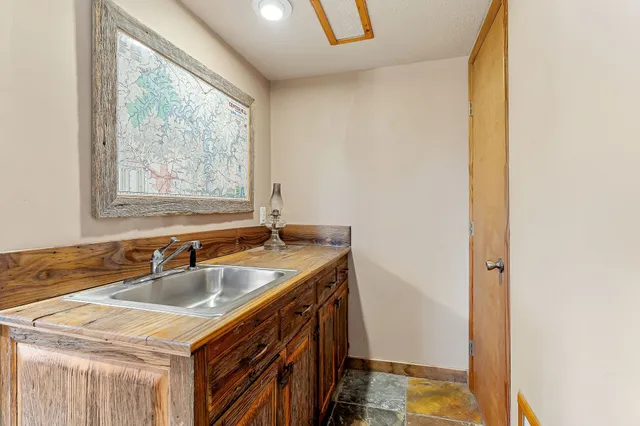 a bathroom with a sink and a window