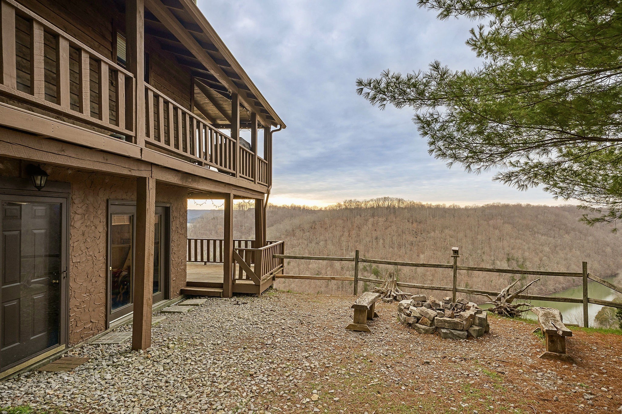 207 Dillon Road Baxter, TN 38544 - Photo 32 of 38 a view of a balcony with two chairs and a potted plant