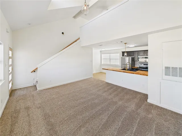 a view of a kitchen with furniture and a kitchen