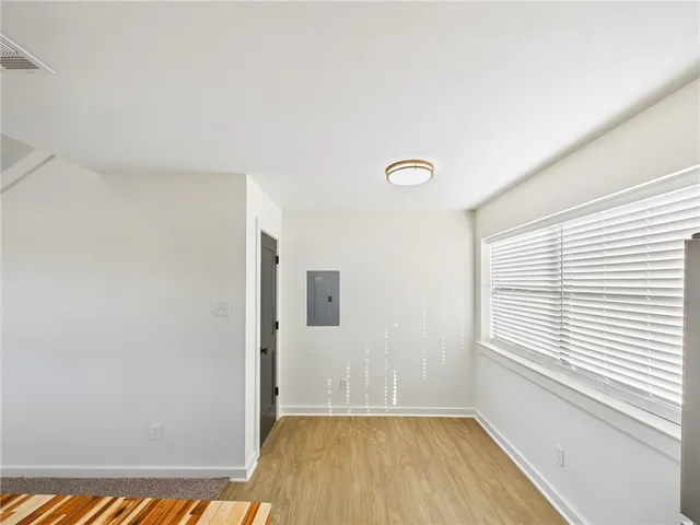 a view of a livingroom with wooden floor