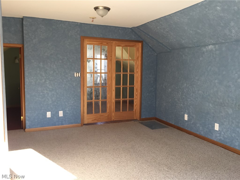 4687 Anderson Road Cleveland, OH 44121 - Photo 16 of 19 Master bedroom. Glass doors to office alcove & stairs. Door left to reading loft.