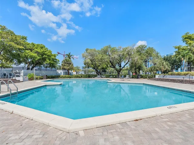 an aerial view of a house with outdoor space