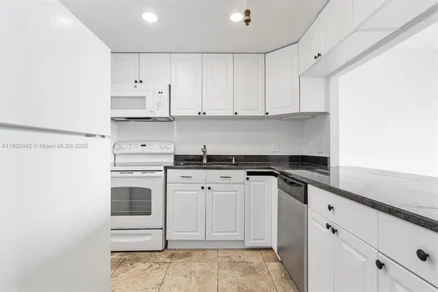 a kitchen with a cabinets and window