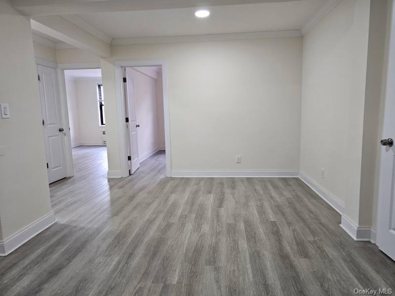 150-11 72nd Road, Unit 4D Queens, NY 11367 - Photo 11 of 11 a view of a room with wooden floor and a sink