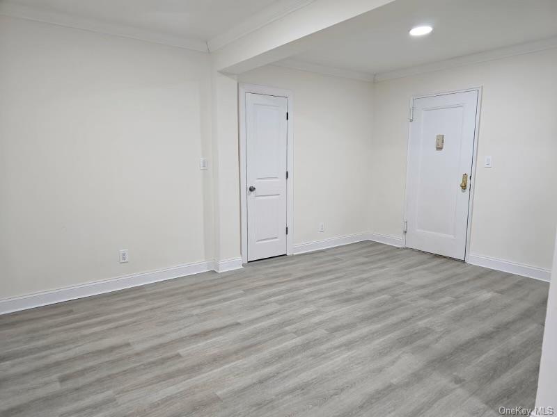 150-11 72nd Road, Unit 4D Queens, NY 11367 - Photo 11 of 13 a view of empty room with wooden floor