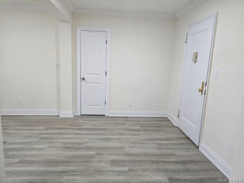 150-11 72nd Road, Unit 4D Queens, NY 11367 - Photo 10 of 13 a view of an empty room with wooden floor