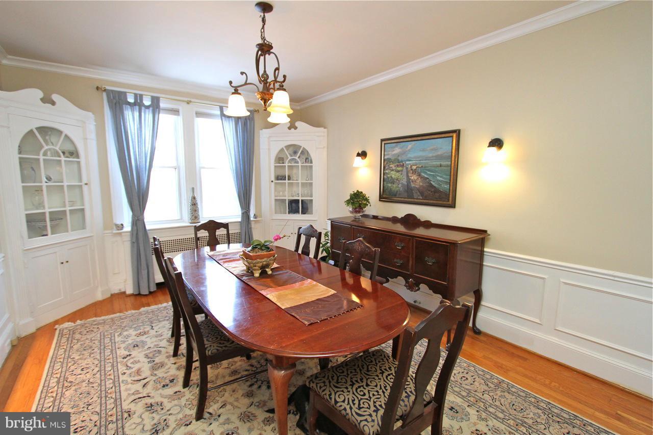 404 Hopkins Road Baltimore, MD 21212 - Photo 4 of 18 a view of a dining room with furniture and a chandelier