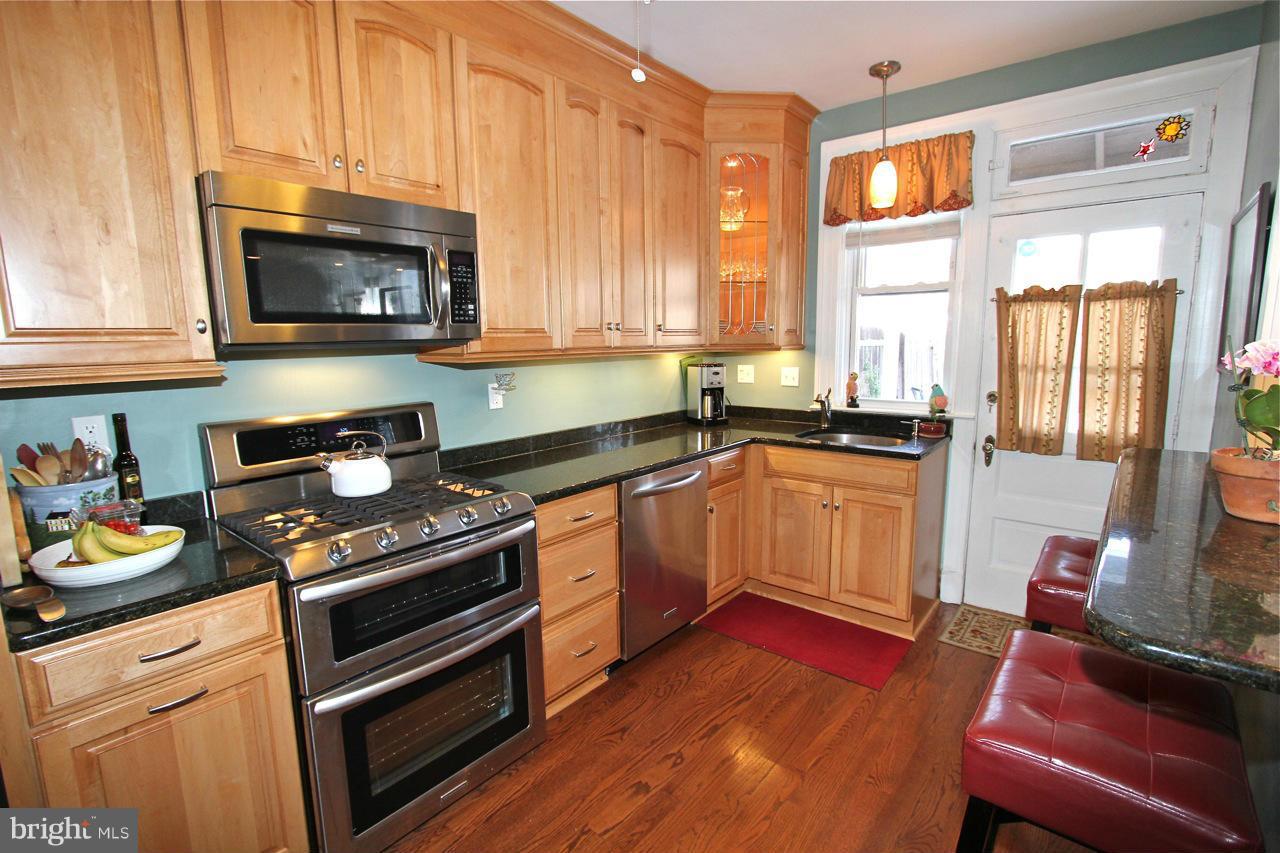 404 Hopkins Road Baltimore, MD 21212 - Photo 6 of 18 a kitchen with a stove and a sink