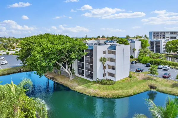 a view of a lake with a building in the background