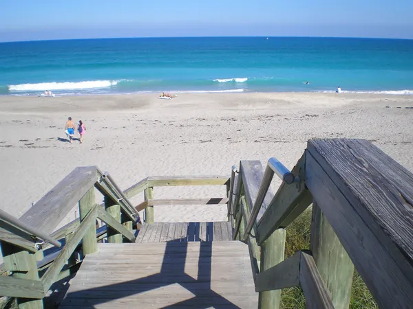 a view of a lake with houses in the back