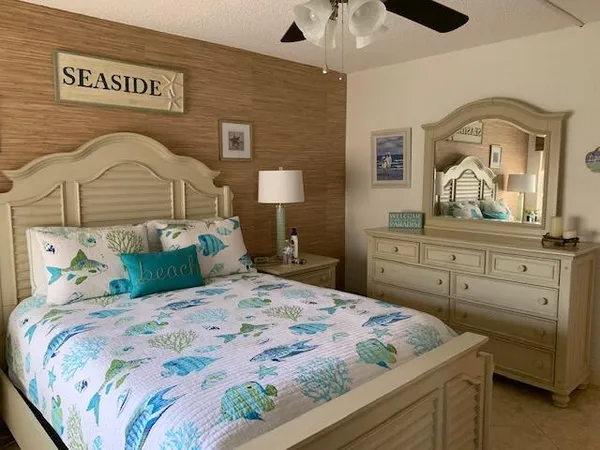 a bedroom with a bed and a dresser